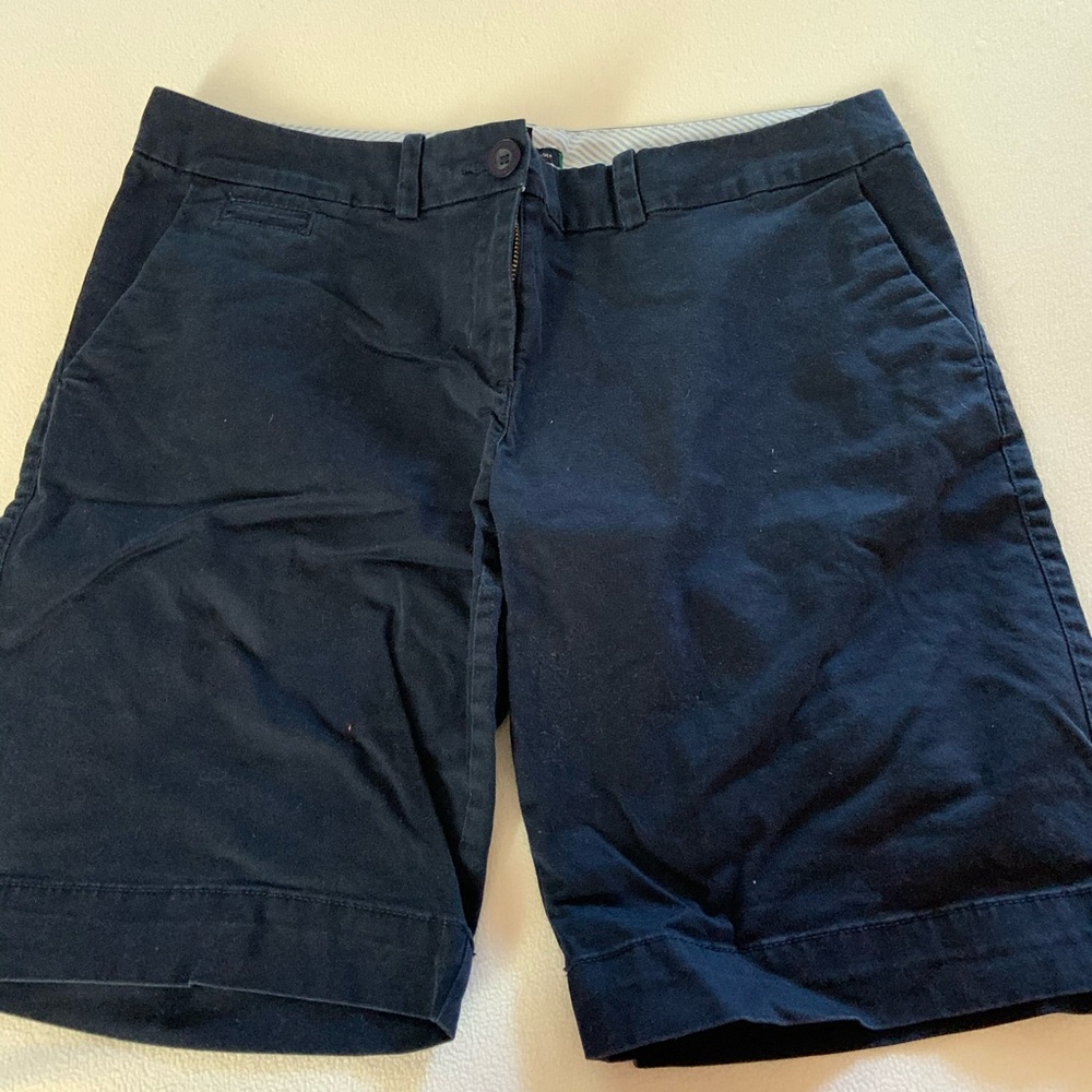 Navy blue Bermuda shorts.